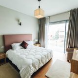 White Bed Near Window