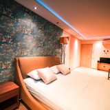 Empty Bed Inside a Lighted Room