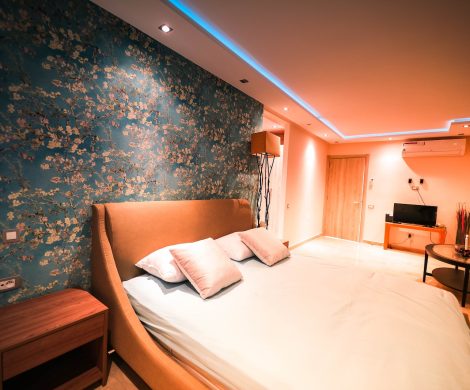 Empty Bed Inside a Lighted Room