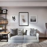 white and black throw pillow on white couch