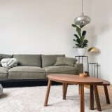 gray 2 seat sofa near brown wooden coffee table