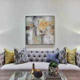 white and blue floral throw pillows on white couch