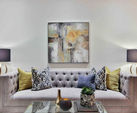 white and blue floral throw pillows on white couch