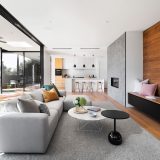white couch beside brown wooden table