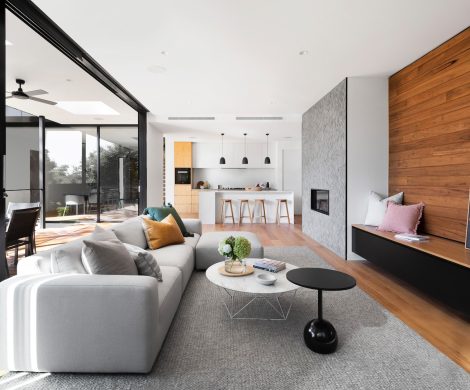 white couch beside brown wooden table