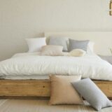 white bed pillow on brown wooden bed frame